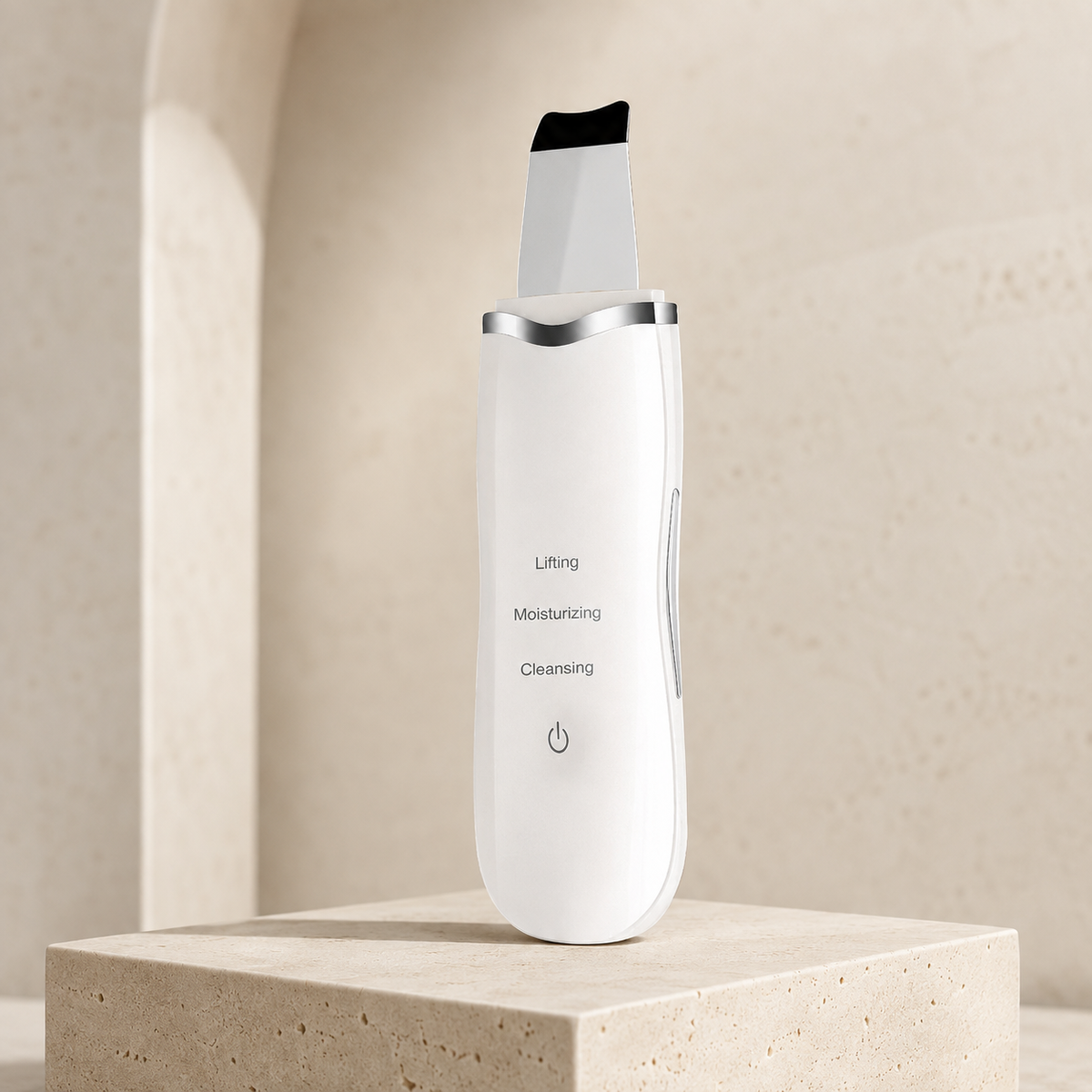 CALUNE PureWave 3-in-1 ultrasonic skin spatula on ivory travertine